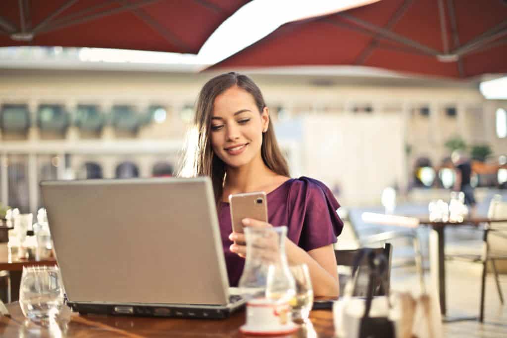 Business Woman Working Outside While Hiring Flexible Hour Jobs Through Boulo