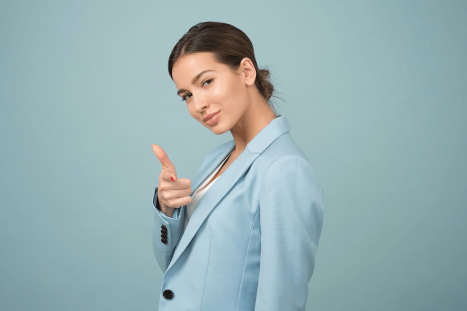 woman giving thumbs up to women on tips to survive recession caused by Covid 19